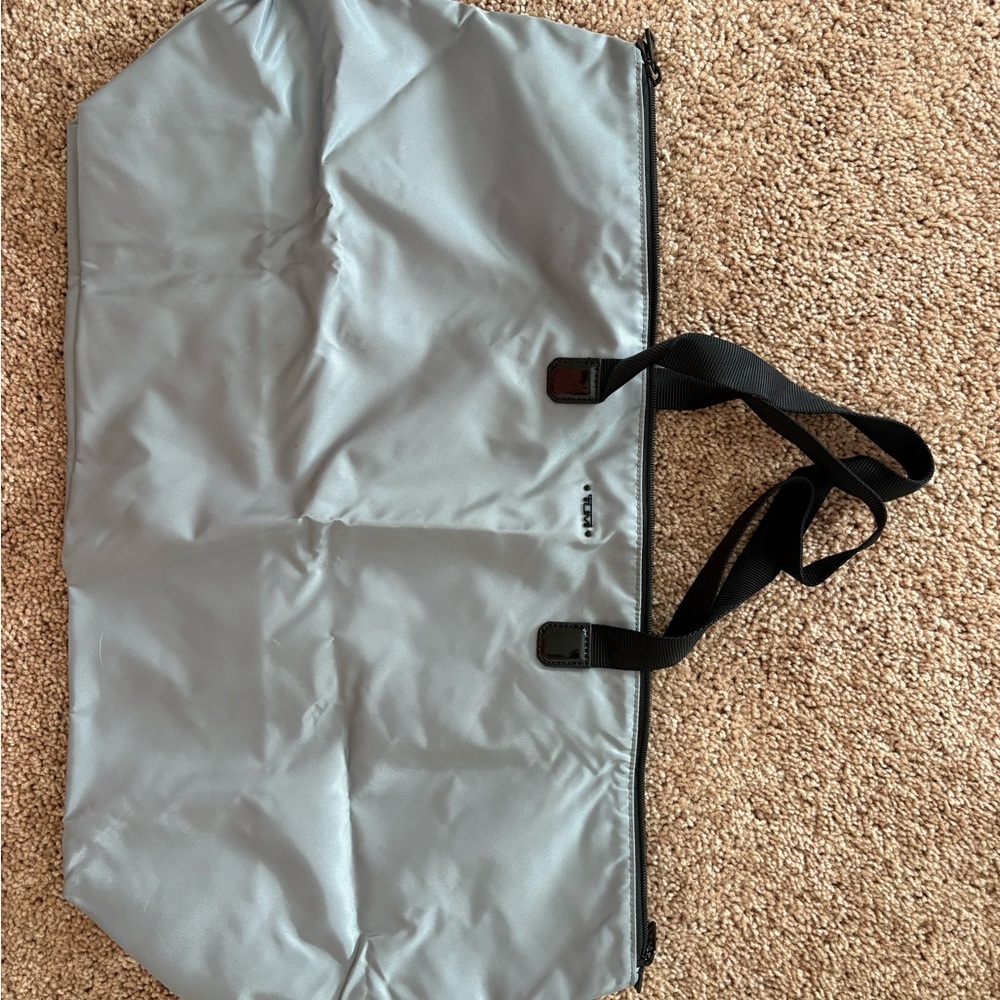 Tumi Silver Travel Tote with Black Straps